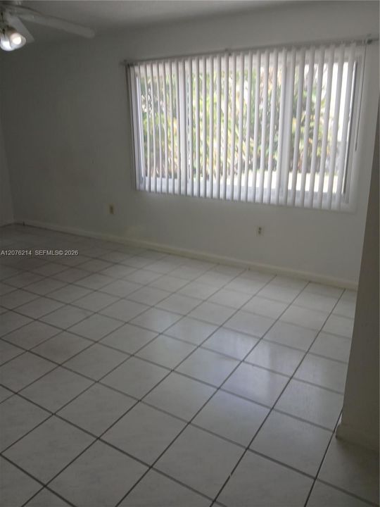 3rd bedroom has a large window w view to the backyard