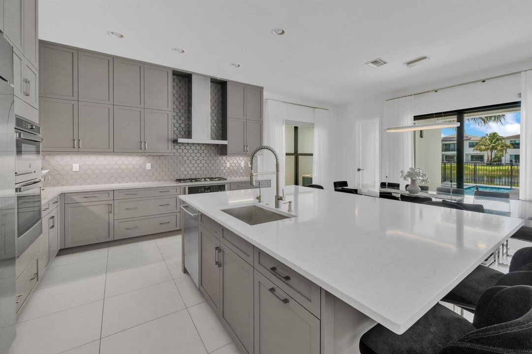 Kitchen — island & range wall