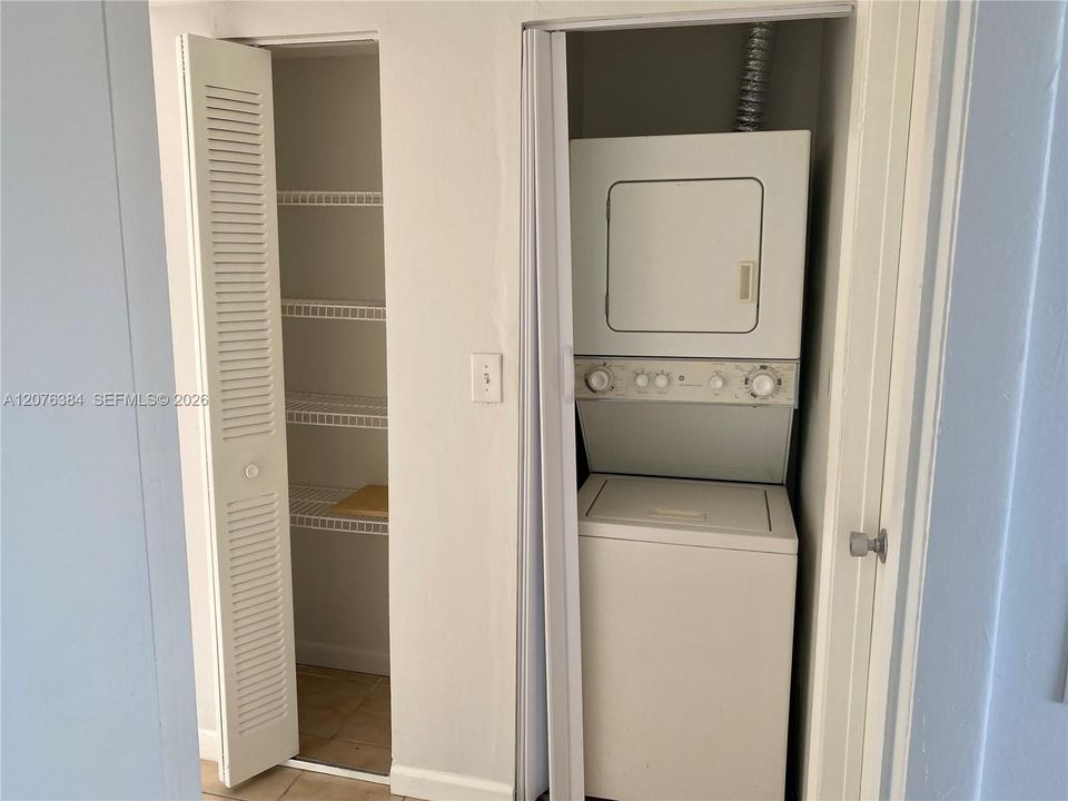 Hallway. Washer and Dryer. Storage Closet