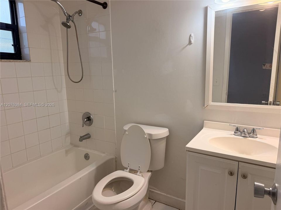Master bathroom with bathtub