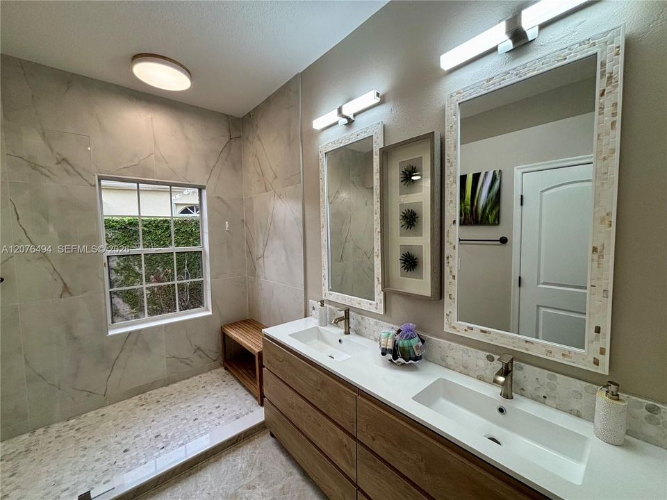 Primary Bath w/double sinks, skylight and oversized shower