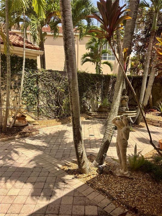 Private walled patio and garden view from Primary Suite