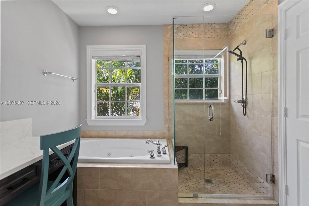 Large jacuzzi tub with large walk in shower.