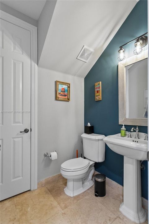 1st Floor 1/2 Bath and Under Stair Storage Closet.