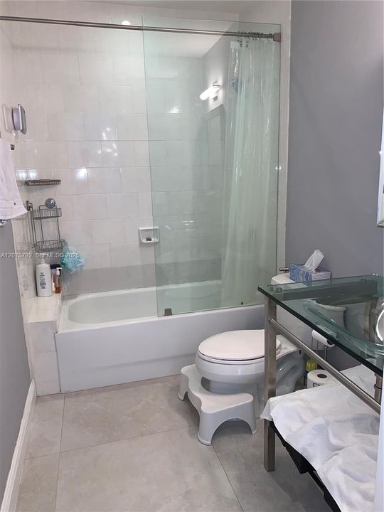 guest bathroom modern fixtures and large deep bath/shower