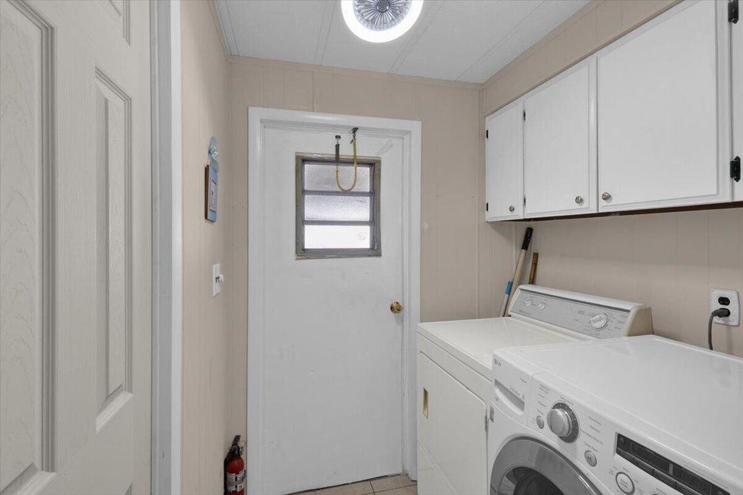 LAUNDRY ROOM WITH ENTRY DOOR