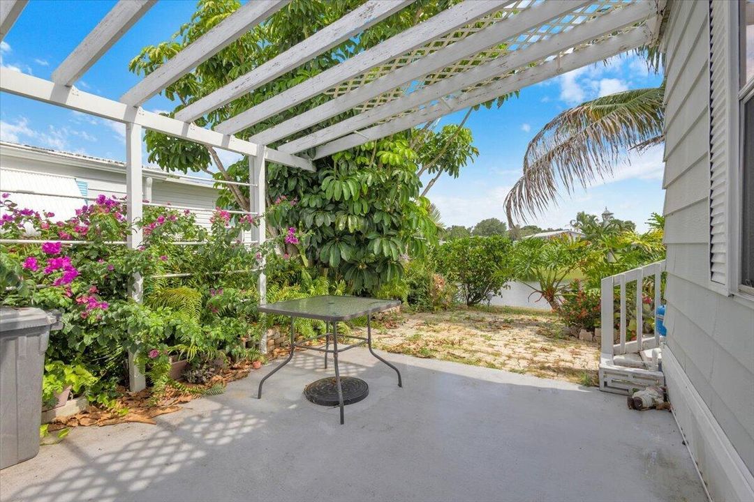 REAR PERGOLA COVERED PATIO/SITTING AREA