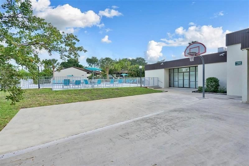 Back of clubhouse has basketball hoop