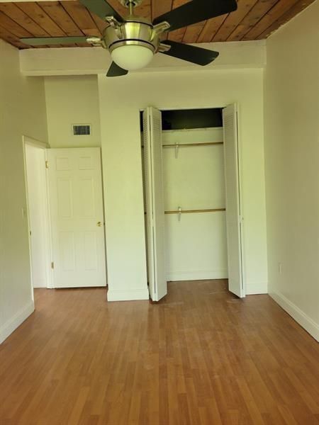Other side of corner bedroom by bathroom