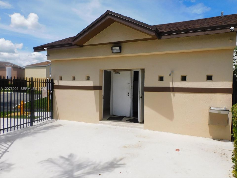 Cabana roof with shower to service community pool area.