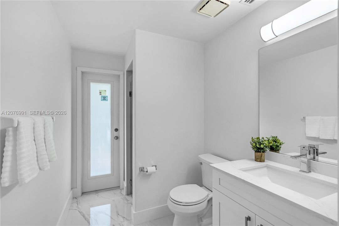 Downstairs bathroom, accessible from pool area too.