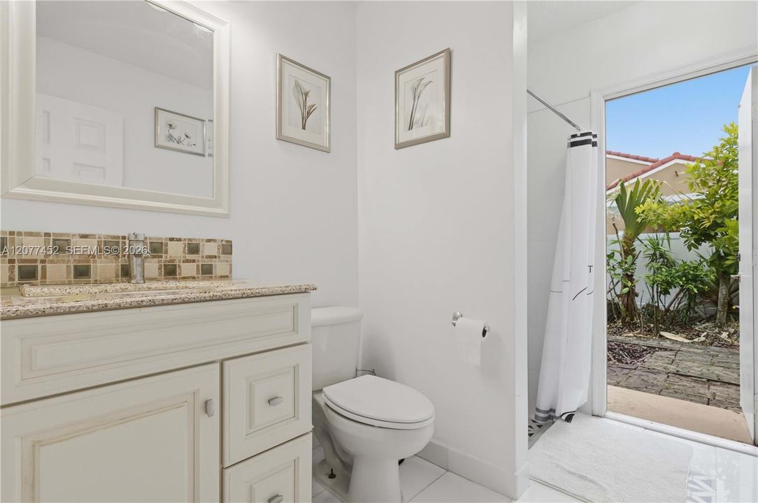 Bathroom # 1 - Cabana with a door to the Backyard.