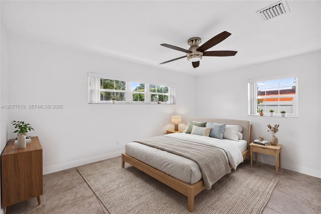 Light-filled bedroom with updated flooring, blinds and generous closet storage. Virtually-Staged.