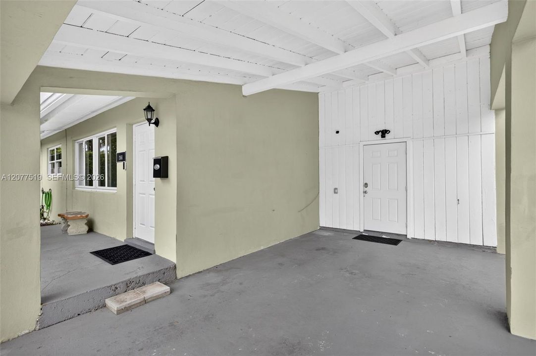 Covered one-car carport provides convenient sheltered parking.