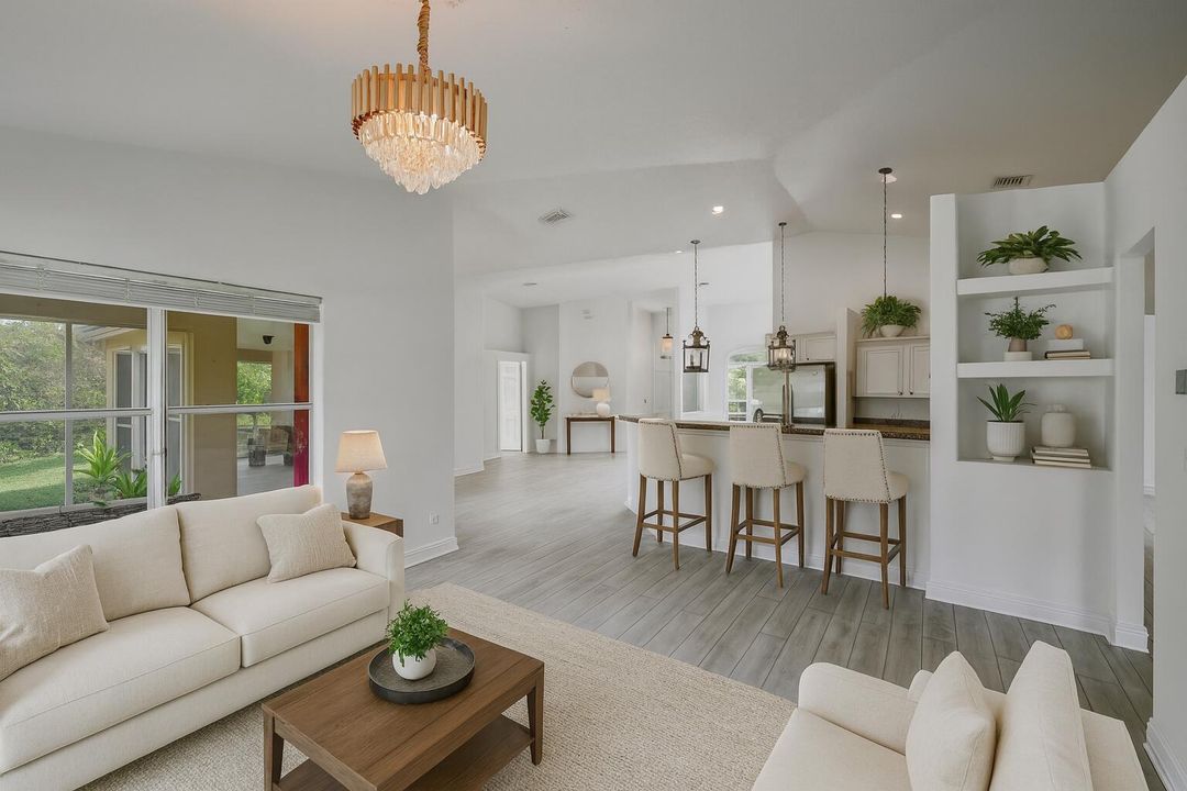 Spacious White Kitchen with Greenery