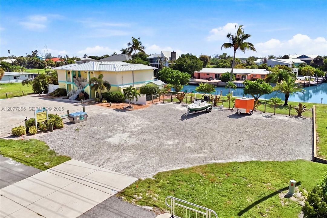 Situated on an oversized double lot, this unique property offers approximately 161 feet of direct, no-bridge Gulf-access canal frontage in the heart of St. James City.