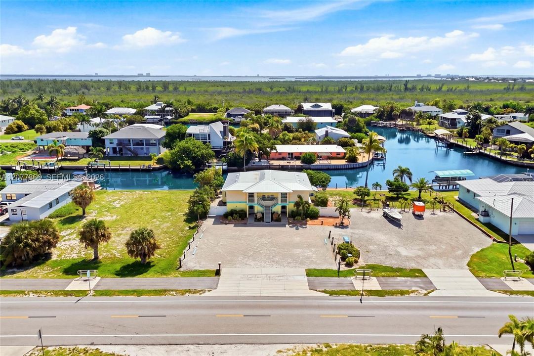 Welcome to Golden Palms Resort, a beautifully updated eight-unit waterfront retreat offering the perfect combination of investment opportunity and laid-back Pine Island living.