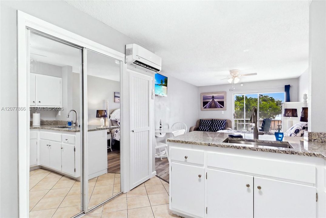THE BEACH ROOM Bright and inviting kitchen designed for both short-term vacation guests and extended stays.