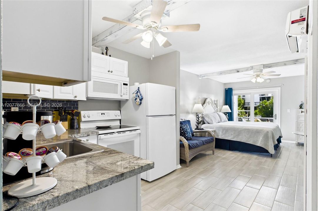 THE CRANE ROOM Each thoughtfully designed studio features an open bedroom and living area, creating a comfortable and functional space with a fresh coastal feel.