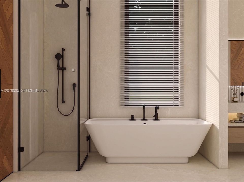 Bright bathroom featuring glass-enclosed shower, freestanding tub, and natural light.