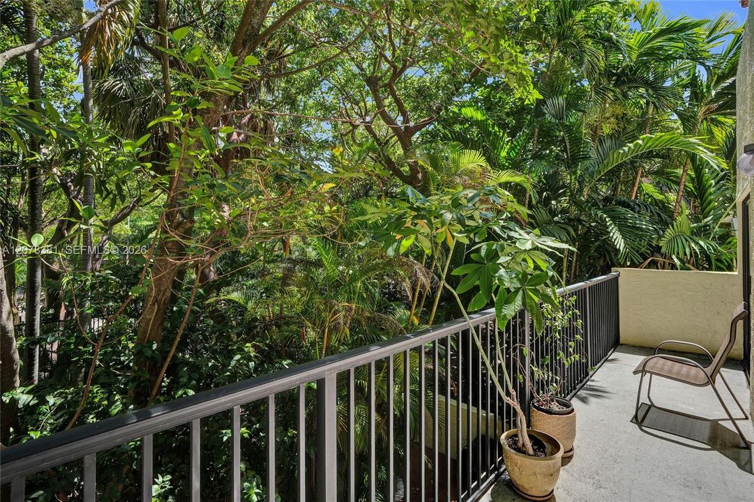 This corner townhouse situated on the east side is surrounded by breathtaking trees and shrubs.