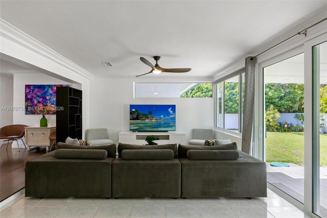 the connection to the backyard makes even the practical spaces feel open and inviting.