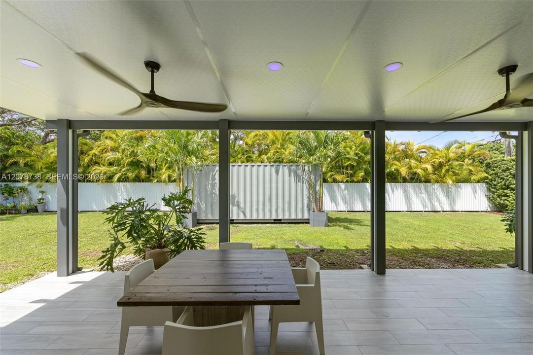 A generous covered dining area made for meals that turn into evenings.
