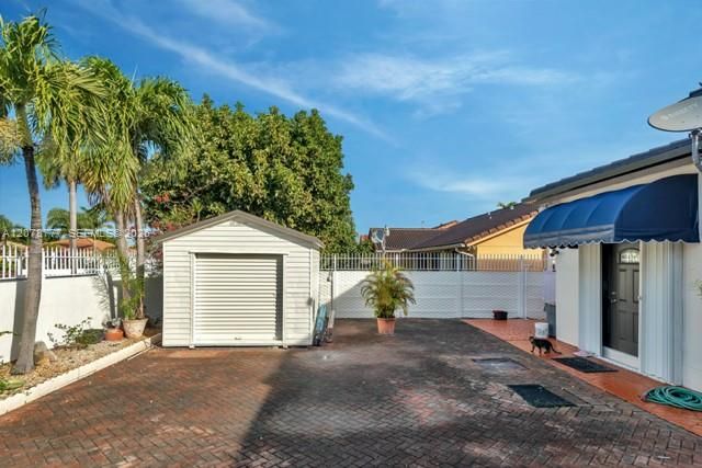 Storage Shed with Large Roll-up Door