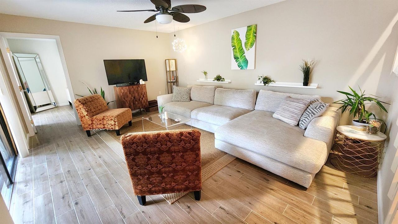Living room looks out to patio
