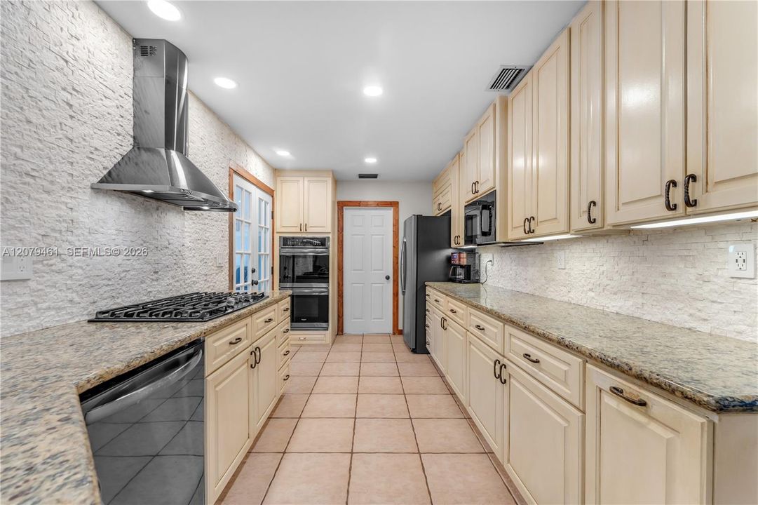 REMODELED CHEF'S KITCHEN WITH GAS STOVE.