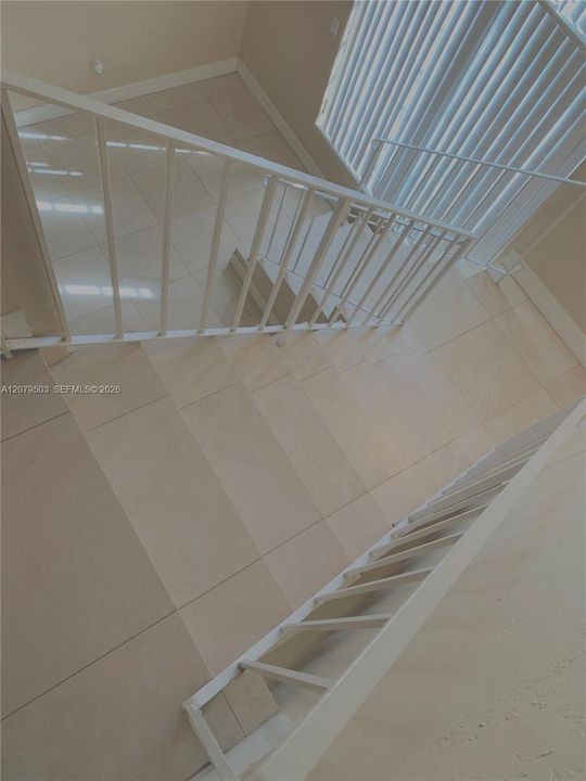 Loft Stairway Dedicated to Exclusive Primary Suite.