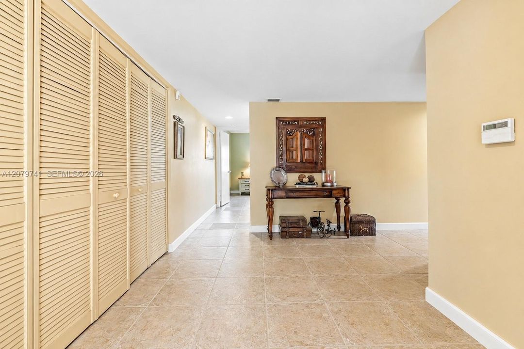 Generous entrance foyer with an impressive wall of closets provides exceptional storage.