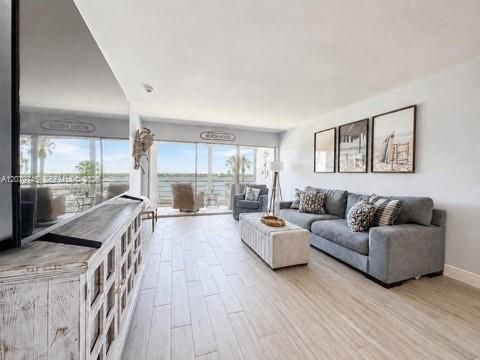 Living room- entire house has wood-like TILE floors.