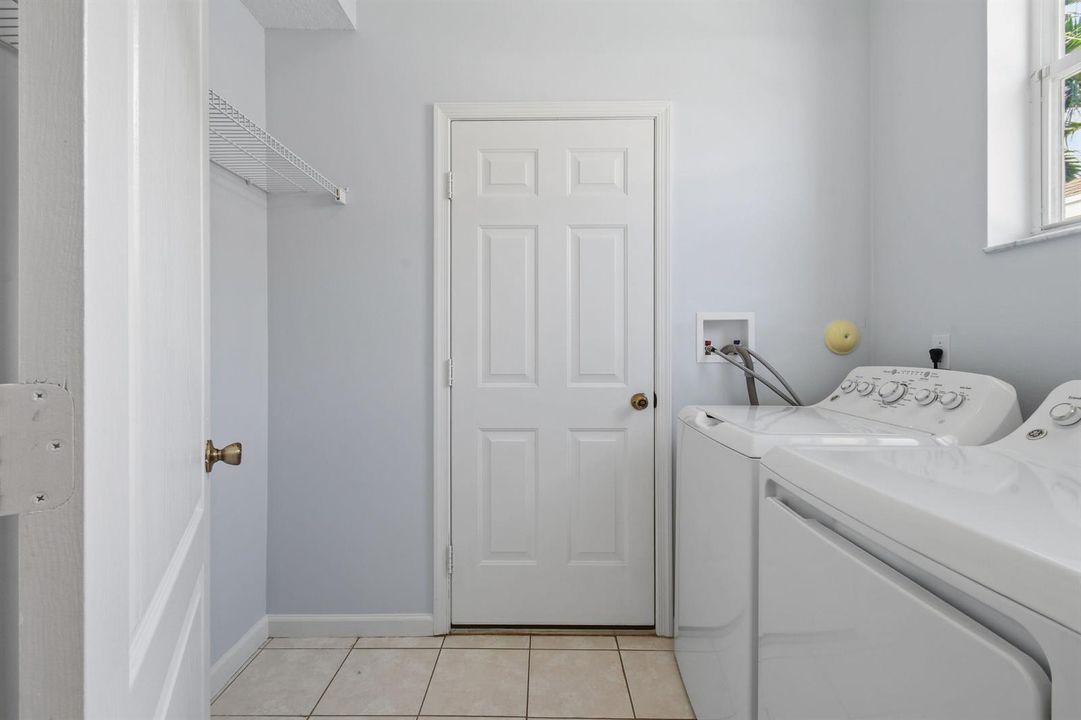 Laundry Room Leads into Attached Garage