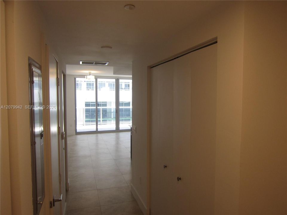 Entrance hallway:washer & Dryer and extra storage closet