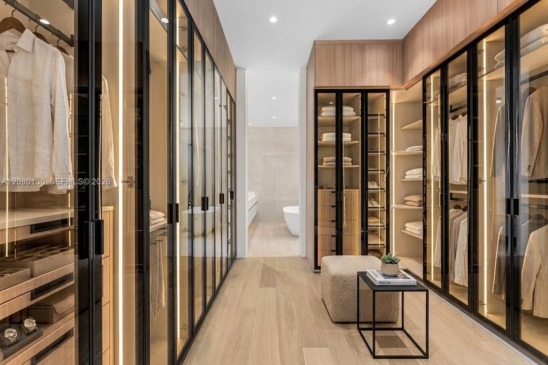 Primary Dressing Room. Disclaimer: Several photographs presented in this listing contain digitally added furniture, artwork, and decor. These virtually staged images are intended solely for illustrative purposes.