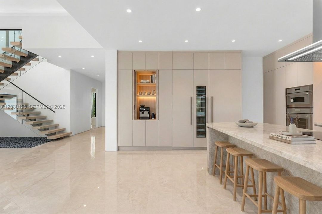 Kitchen. Disclaimer: Several photographs presented in this listing contain digitally added furniture, artwork, and decor. These virtually staged images are intended solely for illustrative purposes.
