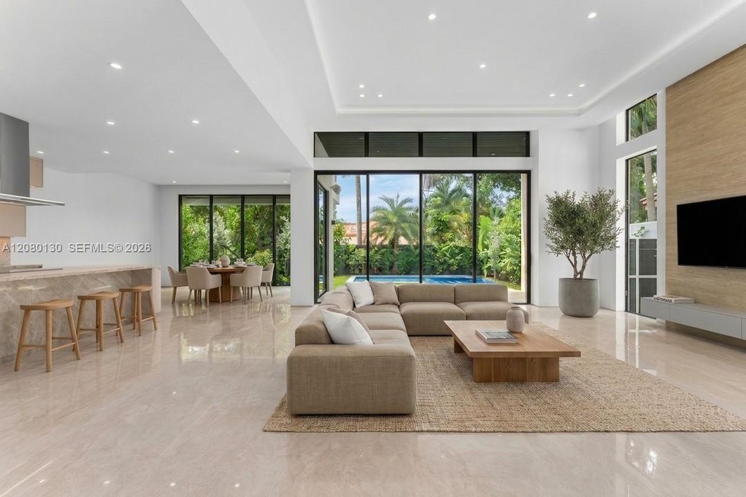 Living Room. Disclaimer: Several photographs presented in this listing contain digitally added furniture, artwork, and decor. These virtually staged images are intended solely for illustrative purposes.