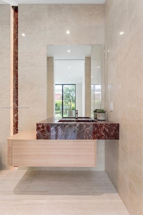 Guest Bathroom. Disclaimer: Several photographs presented in this listing contain digitally added furniture, artwork, and decor. These virtually staged images are intended solely for illustrative purposes.