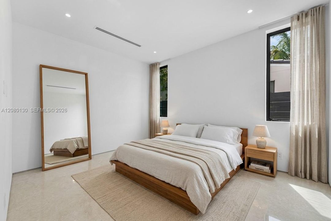Guest Bedroom. Disclaimer: Several photographs presented in this listing contain digitally added furniture, artwork, and decor. These virtually staged images are intended solely for illustrative purposes.