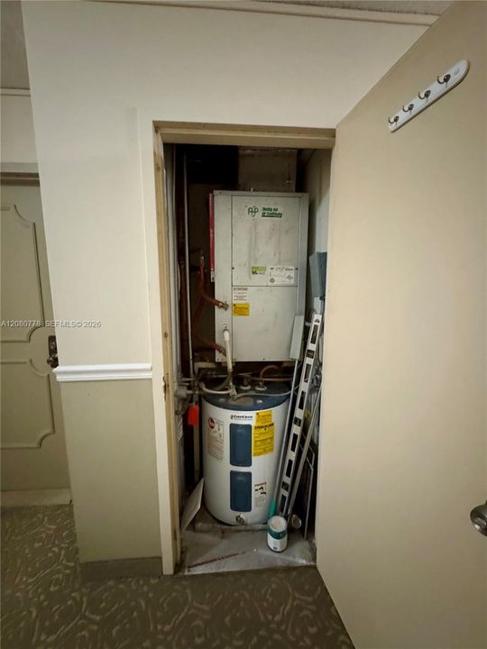Next door storage for a/c unit and water heater, exterior A/C placement for quiet comfort.
