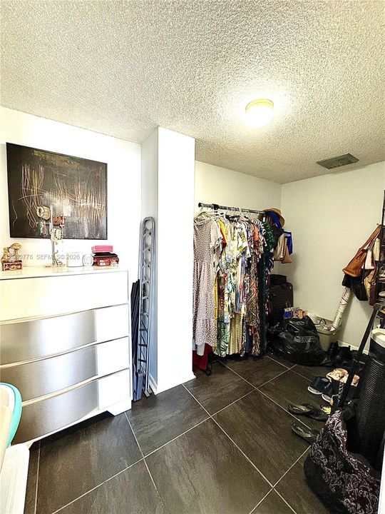 Huge walking closet, could use part of its space for anything else.