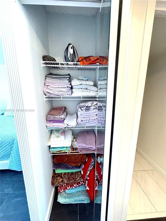 Third closet in bedroom, could be used for linens
