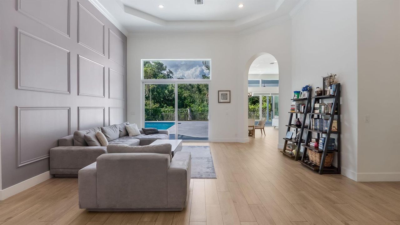Spacious living room with pool view
