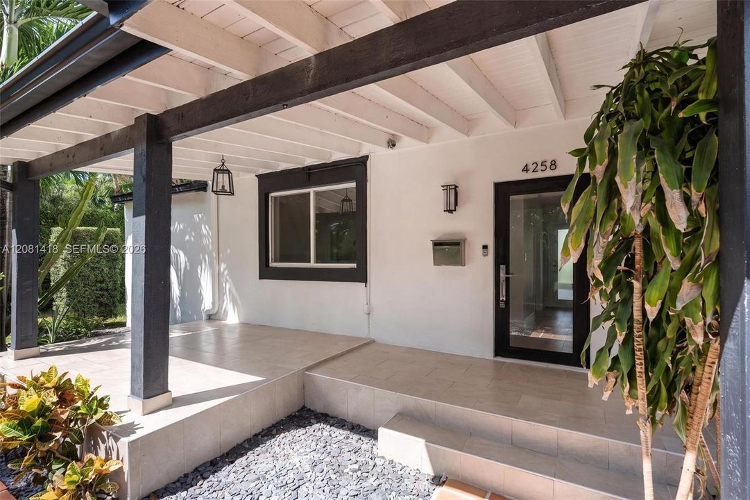 Covered entry patio overlooking the front garden