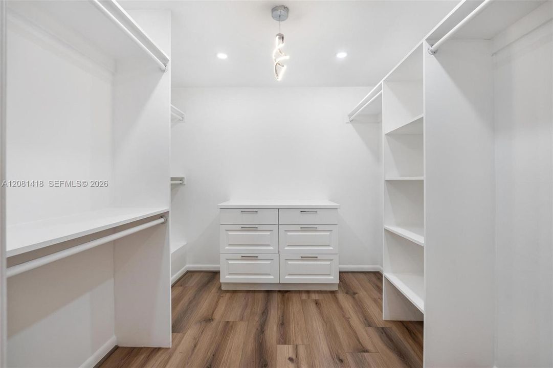 Main-level primary suite dedicated dressing room