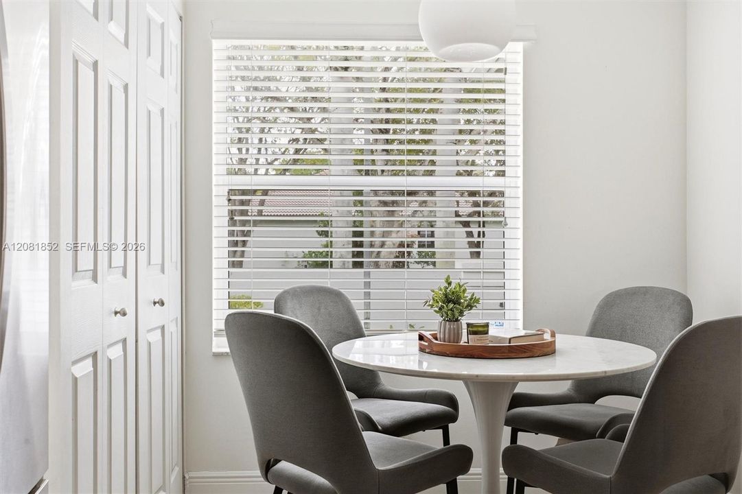 Cozy breakfast area with picturesque window views.