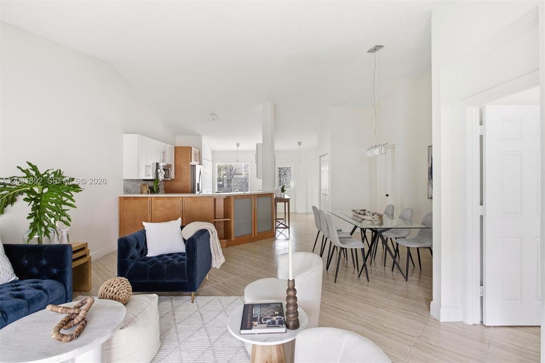Open-concept living area flows effortlessly into the adjacent dining space.