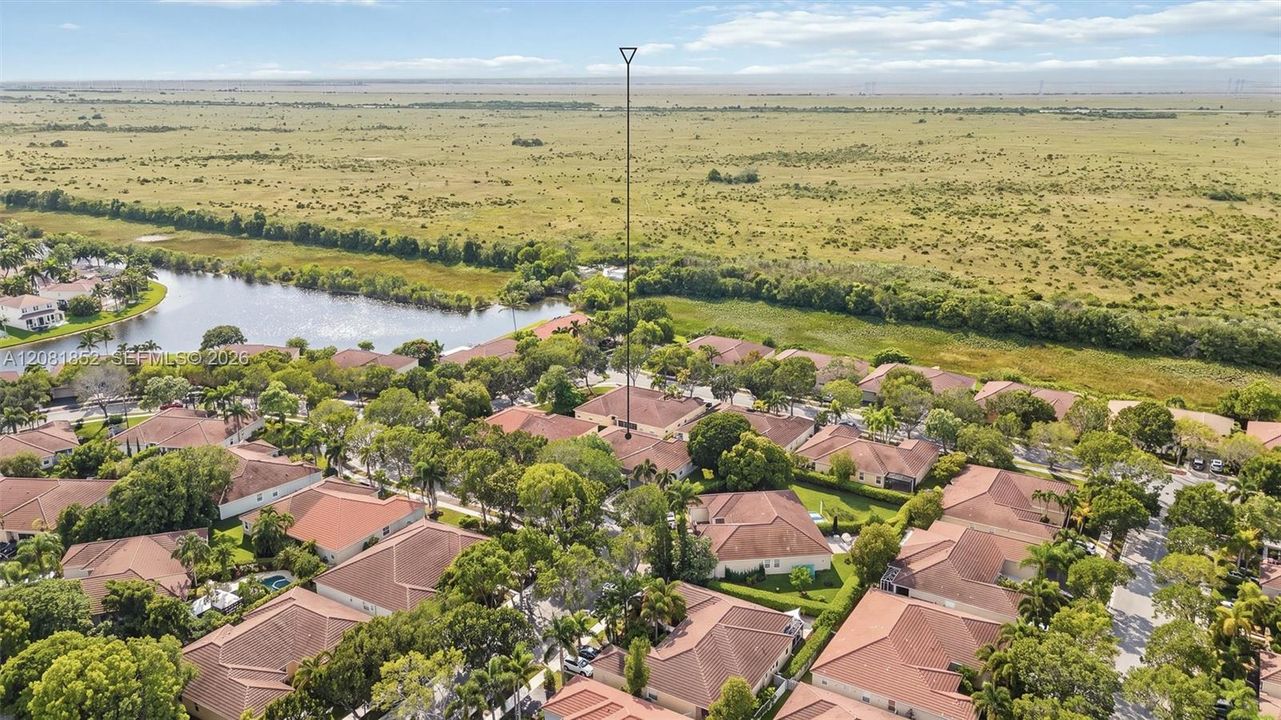 Aerial perspective highlighting the tranquil nature preserve bordering the community.