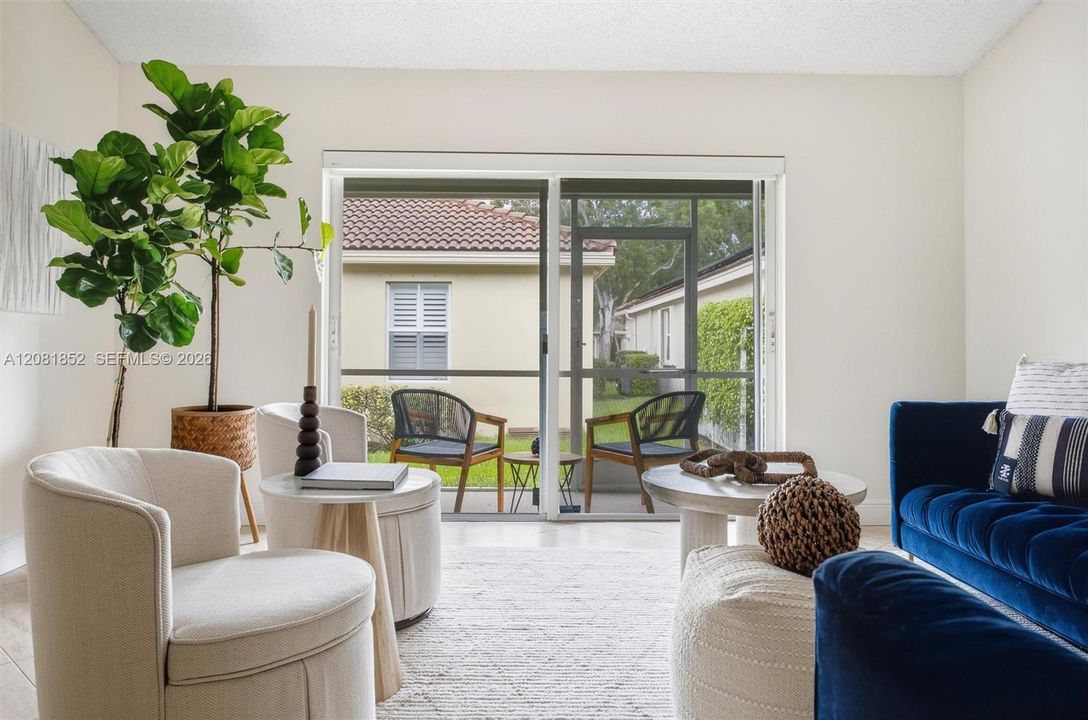 Stylishly staged living area featuring designer accents and abundant natural light.